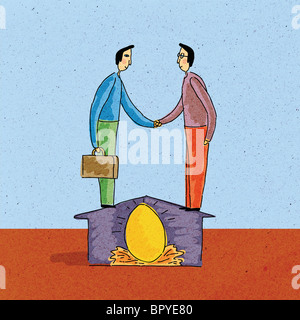 Deux hommes se serrant la main, debout sur house, plus de laine Banque D'Images