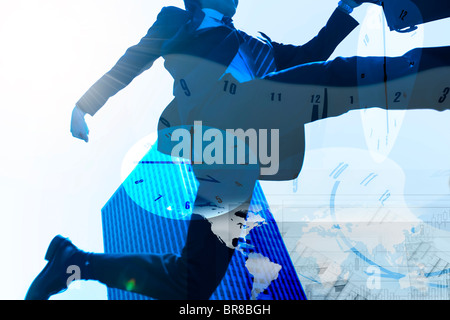Businessman jumping et horloges Banque D'Images
