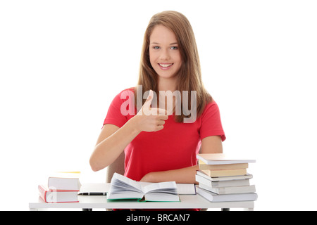 Teen girl learning - Thumbs up, isolé sur fond blanc Banque D'Images