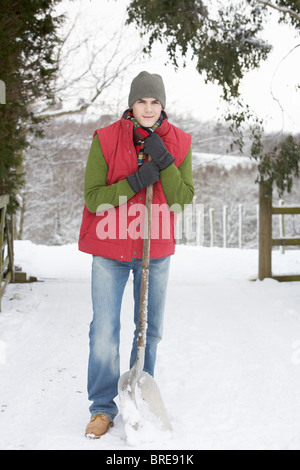 Jeune homme de la neige dur Banque D'Images