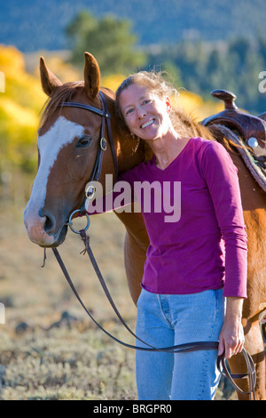 Portrait d'une femme avec son quarter horse Banque D'Images