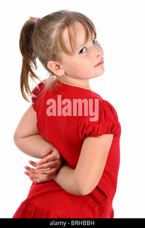 Petite fille habillé en rouge à la Par-dessus son épaule isolated on white Banque D'Images