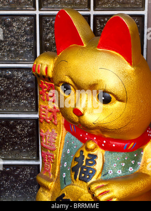 Maneki Neko Sculpture,'signe Cat', Chinatown, NYC Banque D'Images