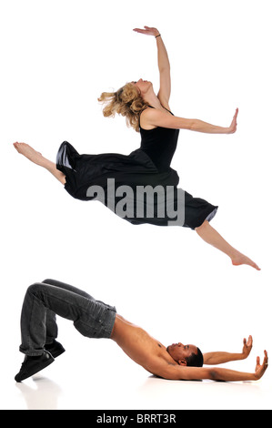 Dancers performing isolé sur fond blanc Banque D'Images