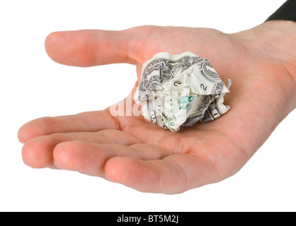 Homme hand holding dollar froissé photographié sur un fond blanc Banque D'Images