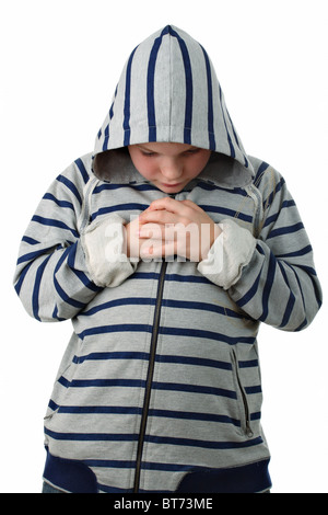 Petit garçon prière avant le match de sport isolated on white Banque D'Images