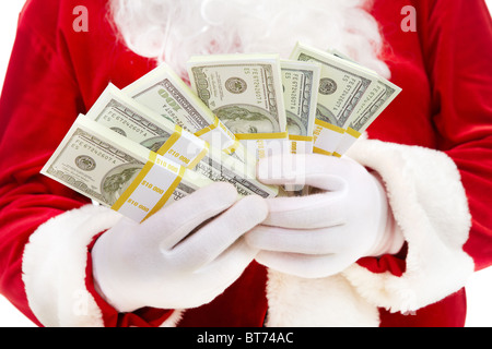 Close-up of Santa's hands avec des piles de billets en dollars Banque D'Images