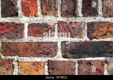 Gros plan du mur de brique rouge vieilli Banque D'Images