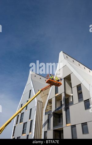 Les travailleurs de la construction en bâtiment Banque D'Images