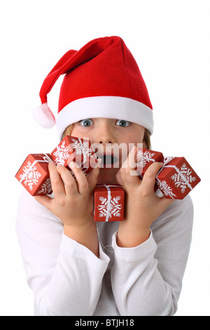 Surpris girl in Santa's red hat isolated on white Banque D'Images