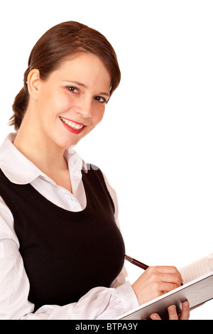 Attractive smiling business woman écrit dans l'annexe. Isolé sur fond blanc. Banque D'Images