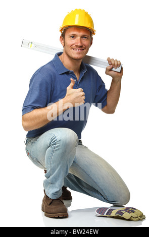 Homme accroupi avec niveau à bulle isolated on white Banque D'Images