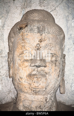 En pierre de Bouddha, grottes de Longmen et grottes, Luoyang, province du Henan, Chine Banque D'Images