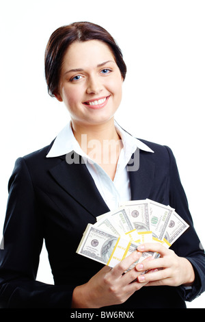 Portrait of young woman holding fan de dollars et looking at camera avec Smile Banque D'Images