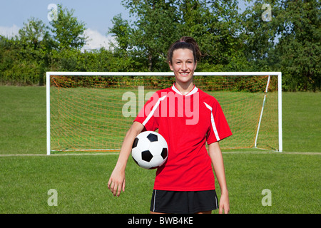 Girl soccer player with ball