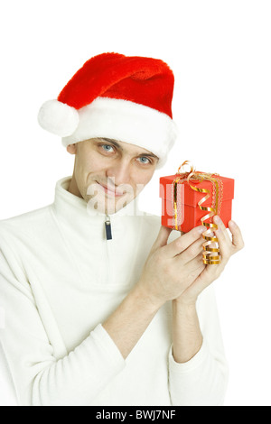 Le jeune homme habillé en boîte-cadeau de Noël est titulaire de la pac Banque D'Images