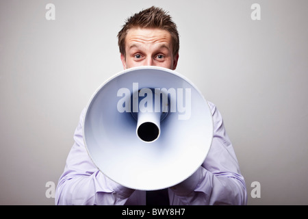 Businessman With Megaphone Banque D'Images