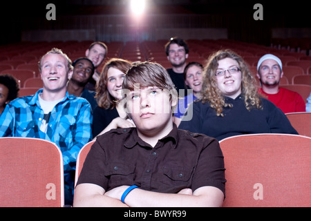 Friends watching movie in theatre Banque D'Images