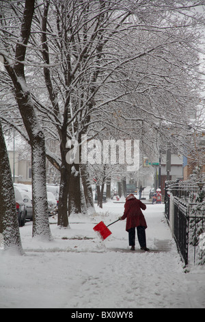 Femme de la neige du trottoir. Banque D'Images