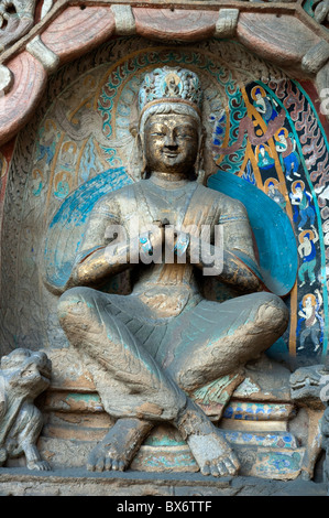 Statue de Bouddha sculptée à l'intérieur de l'ancien Grottes de Yungang, Datong, Shanxi, en Chine. Banque D'Images