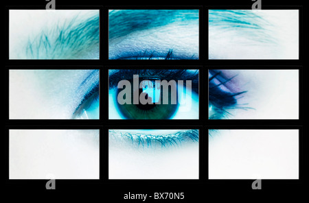 Grand plat composé de bord par beaucoup d'écrans affichant un oeil féminin Banque D'Images
