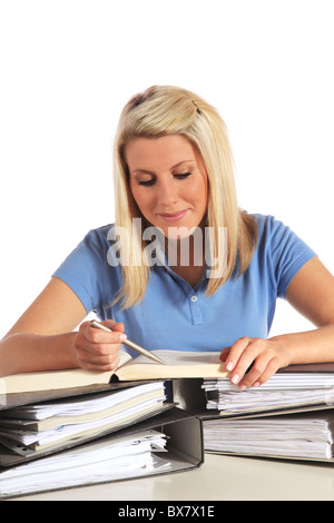 Attractive young woman working. Le tout sur fond blanc. Banque D'Images