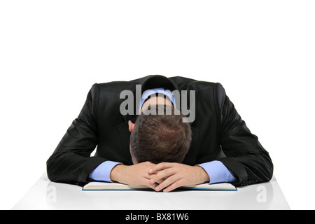 Épuisé man sleeping sur le livre Banque D'Images