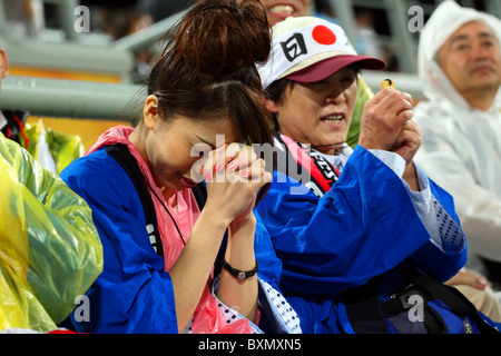 Fans japonais, Argentine 2 Japon 1, Dames Field Hockey finales Jeux Olympiques de Beijing Chine Banque D'Images