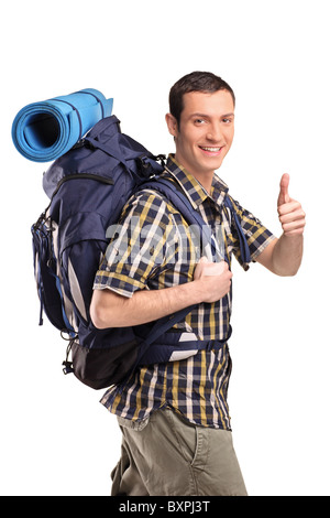 Un portrait d'un homme dans les vêtements de sport avec sac à dos giving thumb up Banque D'Images