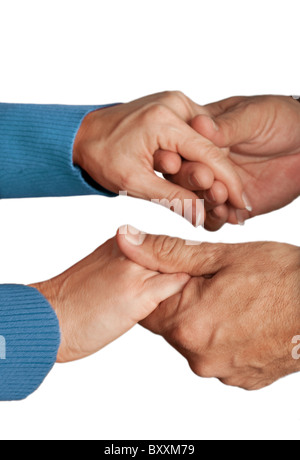 Close-up of middle-aged couple holding hands, studio shot Banque D'Images