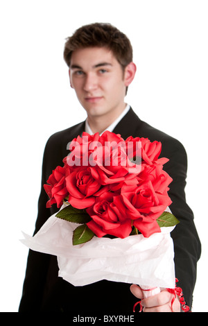 Attractive Woman wearing a suit holding a bouquet of roses isolé sur fond blanc Banque D'Images