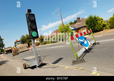 Feux de circulation temporaires montrant green UK Banque D'Images