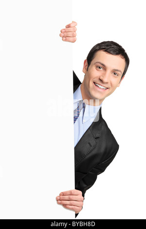 Young businessman holding a blank billboard Banque D'Images