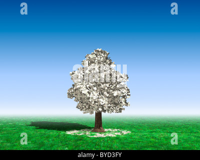 Arbre d'argent au milieu d'un champ avec des centaines de dollars de plus en plus sur elle et couché sur l'herbe verte sous c Banque D'Images