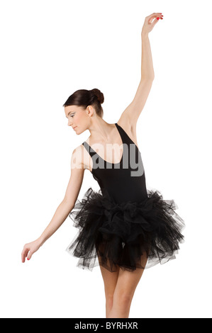 Ballerine gracieuse en tutu noir en tenant un classique danse posent à la bas Banque D'Images