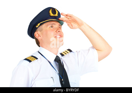 Pilote de ligne gaie en uniforme avec épaulettes et hat regardant vers le haut, l'article isolé sur fond blanc. Banque D'Images