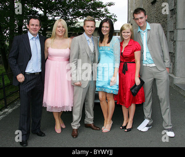 Nicky Byrne de Westlife et son épouse Georgina à l'église St Sylvestre pour le baptême de leurs jumeaux, Jay et Rocco Banque D'Images