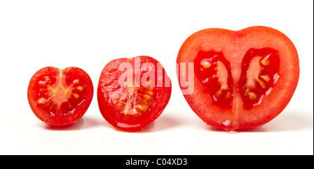 Tomate de trois variétés différentes tranches de isolé sur blanc. Banque D'Images