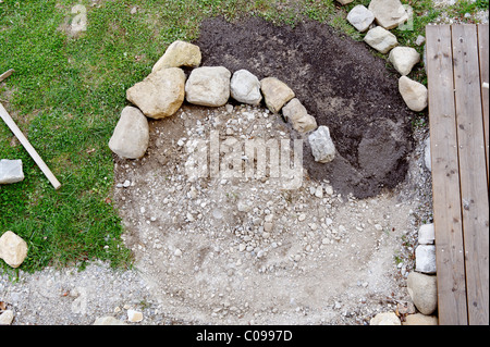 Un Constructiing herb spiral Banque D'Images