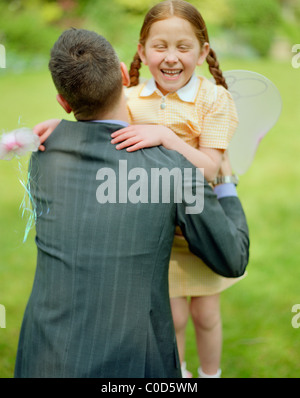 Father daughter wearing fairy wings Banque D'Images