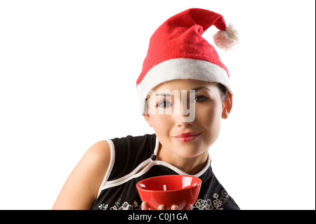 Santa Claus fille asiatique traditionnel chinois rouge holding cup pour le riz Banque D'Images