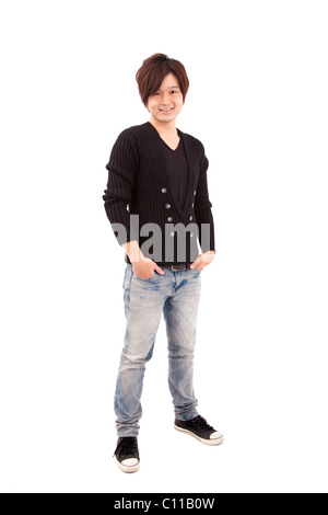 Asian young man standing with hands in pockets isolé sur fond blanc Banque D'Images