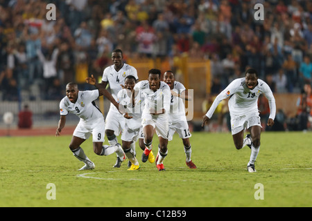 Les joueurs réagissent au Ghana après avoir battu le Brésil dans un penalty shoot out pour gagner le 2009 FIFA U-20 World Cup championship. Banque D'Images