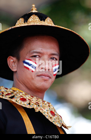 Thai homme portant la peinture du visage et l'habit traditionnel. Banque D'Images