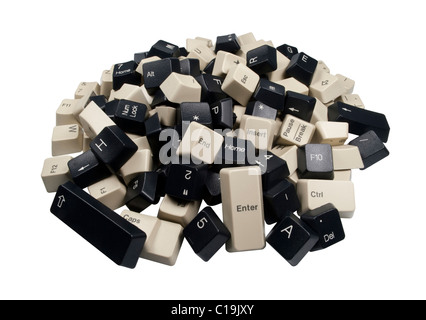 Une pile de noir et blanc des touches du clavier de l'ordinateur isolé sur fond blanc Banque D'Images