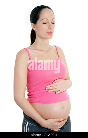 Femme enceinte pratiquer un exercice de respiration Banque D'Images