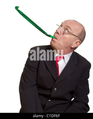 L'expression senior businessman isolated on white party pooper concept Banque D'Images