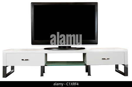 Un meuble TV moderne blanc avec une grande télévision à écran LCD. Banque D'Images