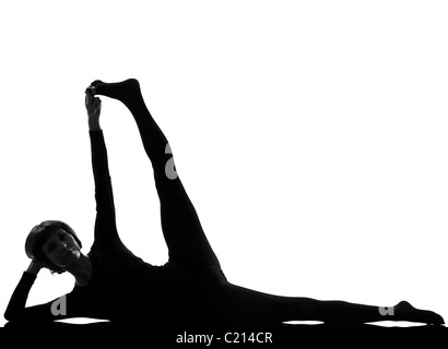 Woman Sleeping Vishnu Yoga Pose yoga pose posture position dans la silhouette sur fond blanc studio ascenseur jambe Side-Reclining Banque D'Images