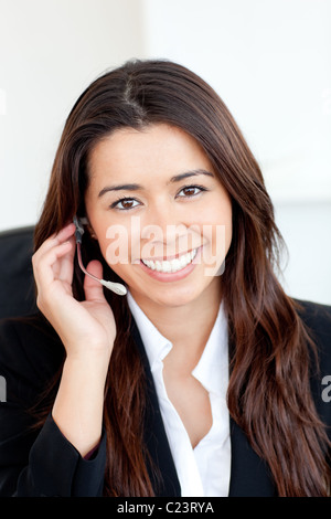 Asian businesswoman wearing headphones Banque D'Images
